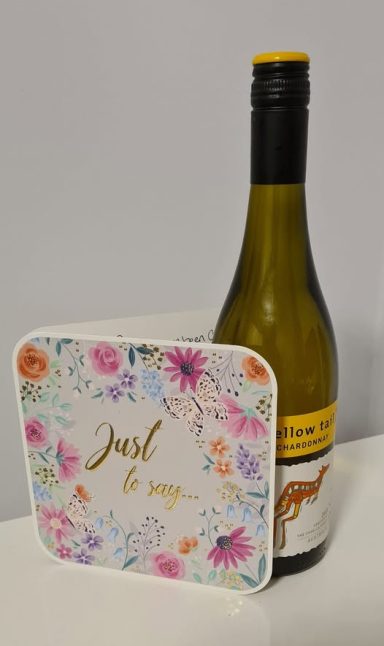 Esther from Penygroes is giving a card and a bottle of wine, how thoughtful, passing 1st time in Carmarthen